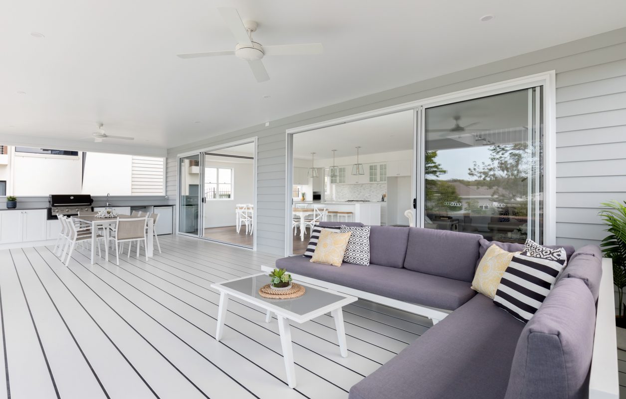 White deck with outdoor kitchen and barbeque in a Hampton and Queenslander home