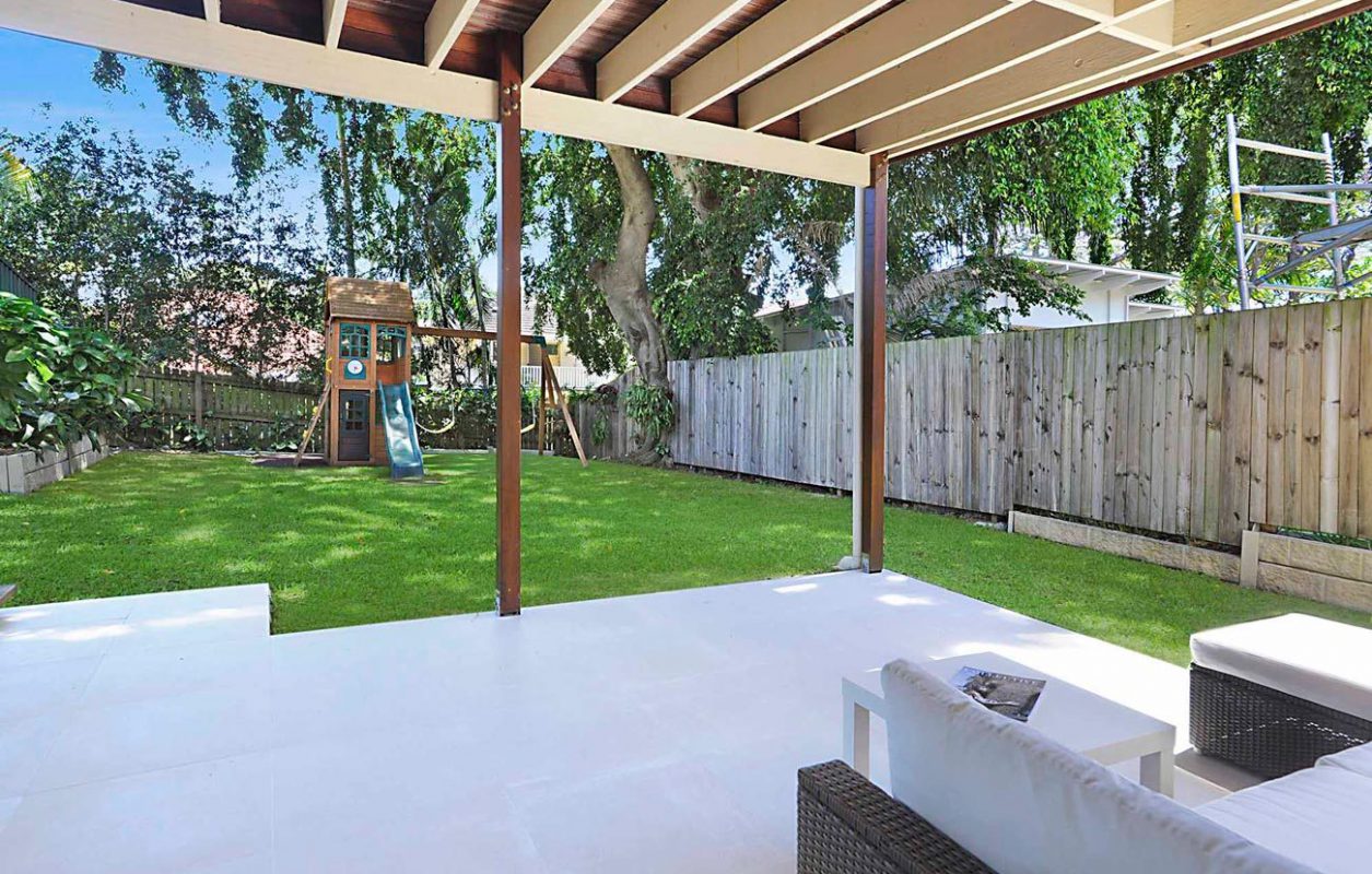 View of the back yard and patio from a renovated home in Brisbane